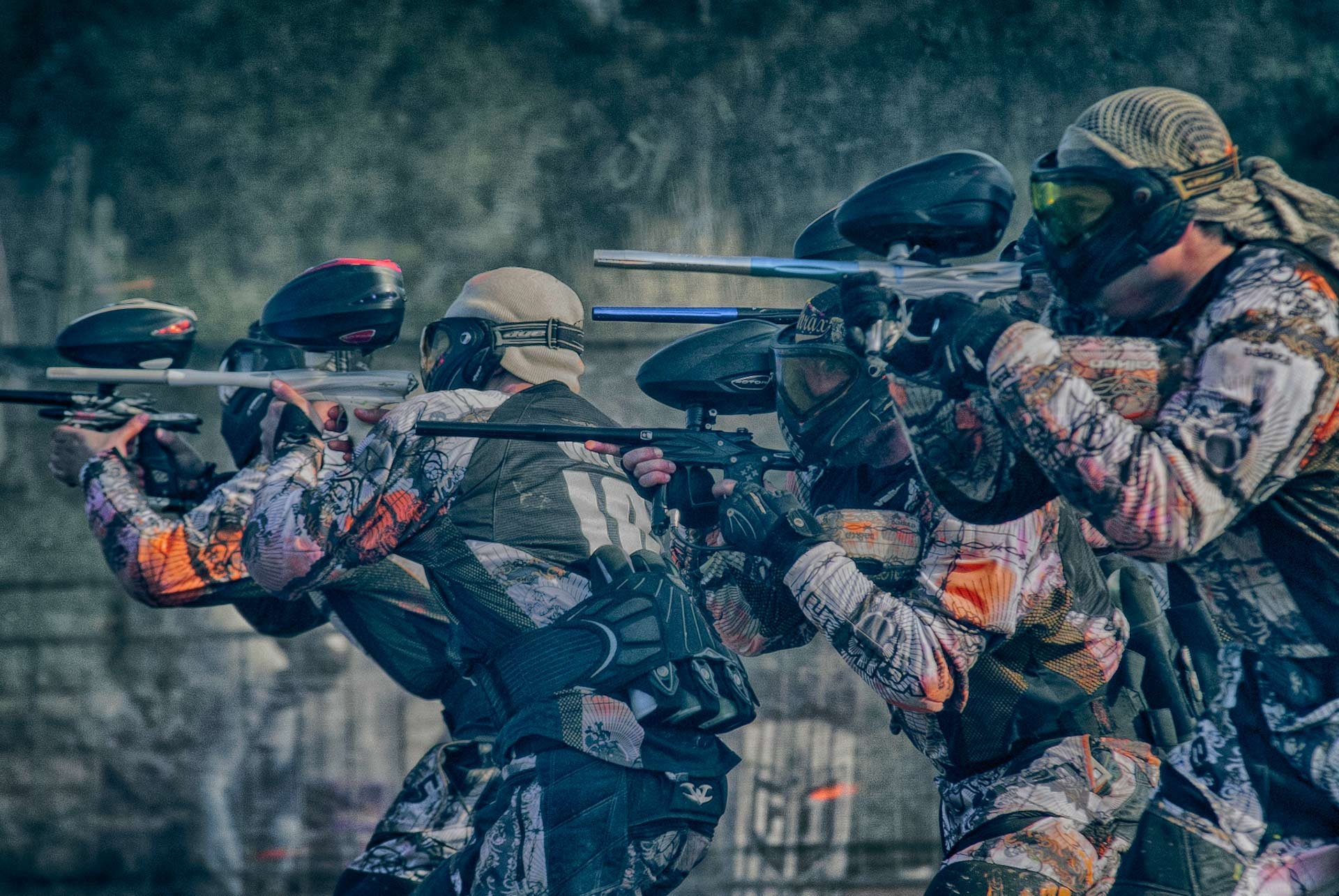 Paintball: An aiming squad, Competitive combat sports discipline and military training session. 1920x1290 HD Background.
