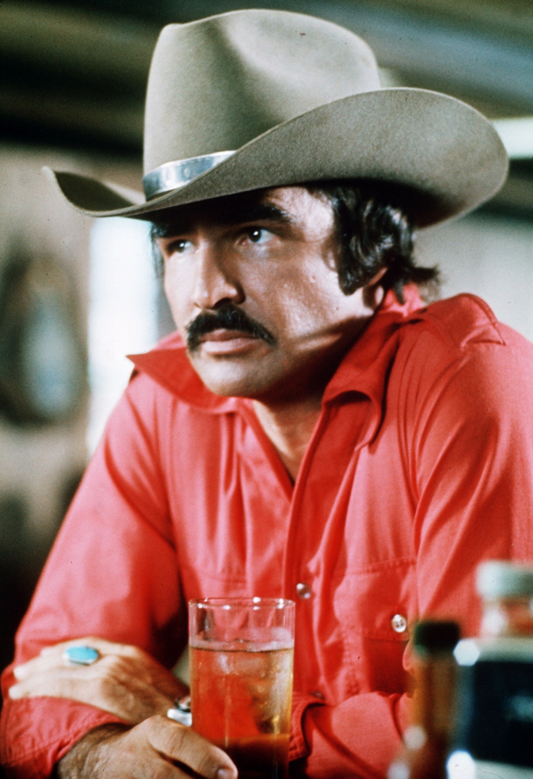 Burt Reynolds: “Smokey and the Bandit,” The 1977 action comedy, The country’s top box-office star for five years. 1760x2560 HD Background.