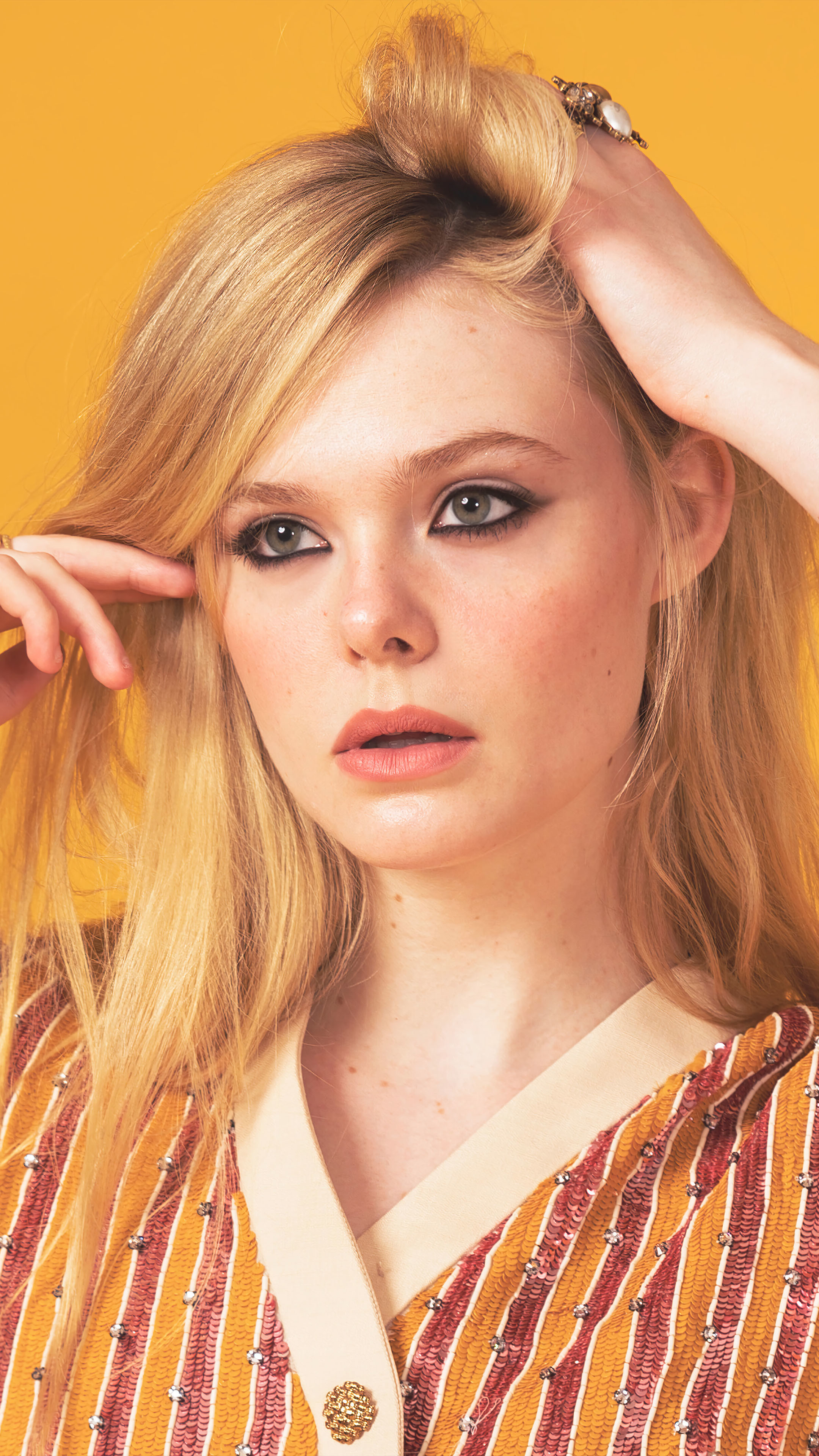 Elle Fanning: The youngest person to serve as a jury member at the Cannes Film Festival. 2160x3840 4K Background.
