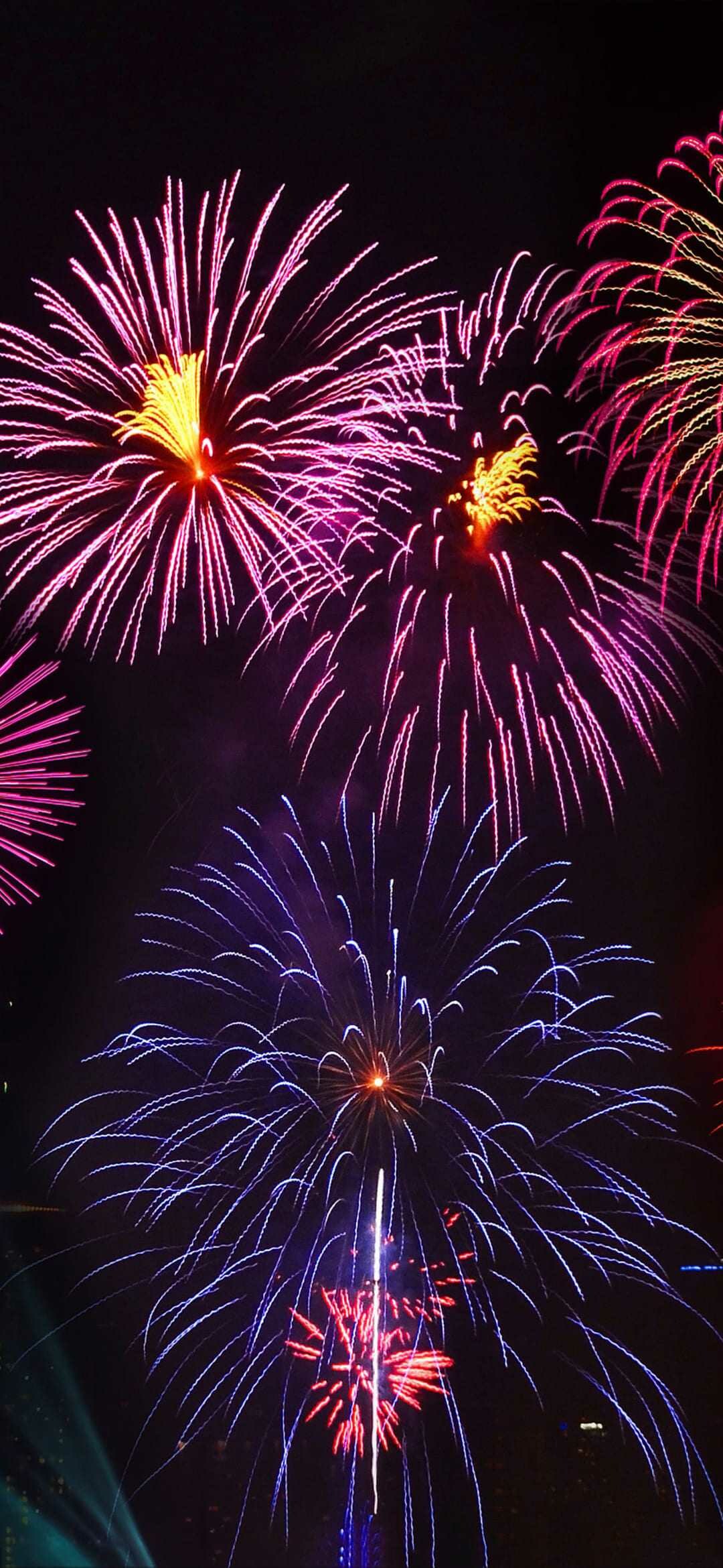 Firework: The earliest forms of pyrotechnics are traced to around 2,000 years ago in China. 1080x2340 HD Background.