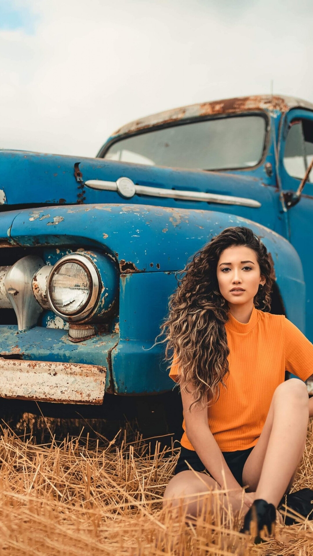 Girls and Trucks: Old rusty car, The girl sitting on the stubble field, Retro Ford vehicle. 1080x1920 Full HD Background.