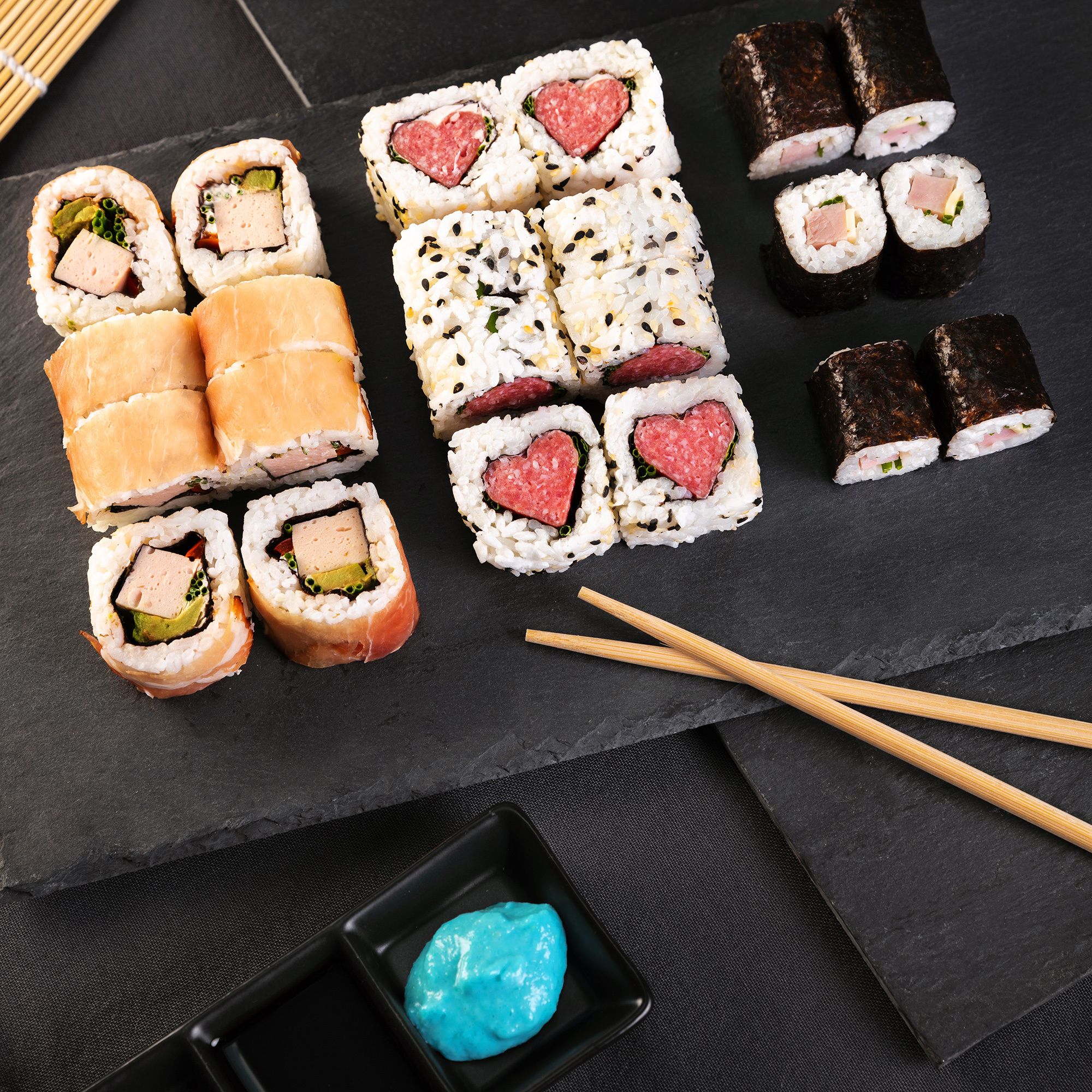 Sushi: Medium-grained rice cooked in vinegar, A variety of toppings or fillings. 2000x2000 HD Background.