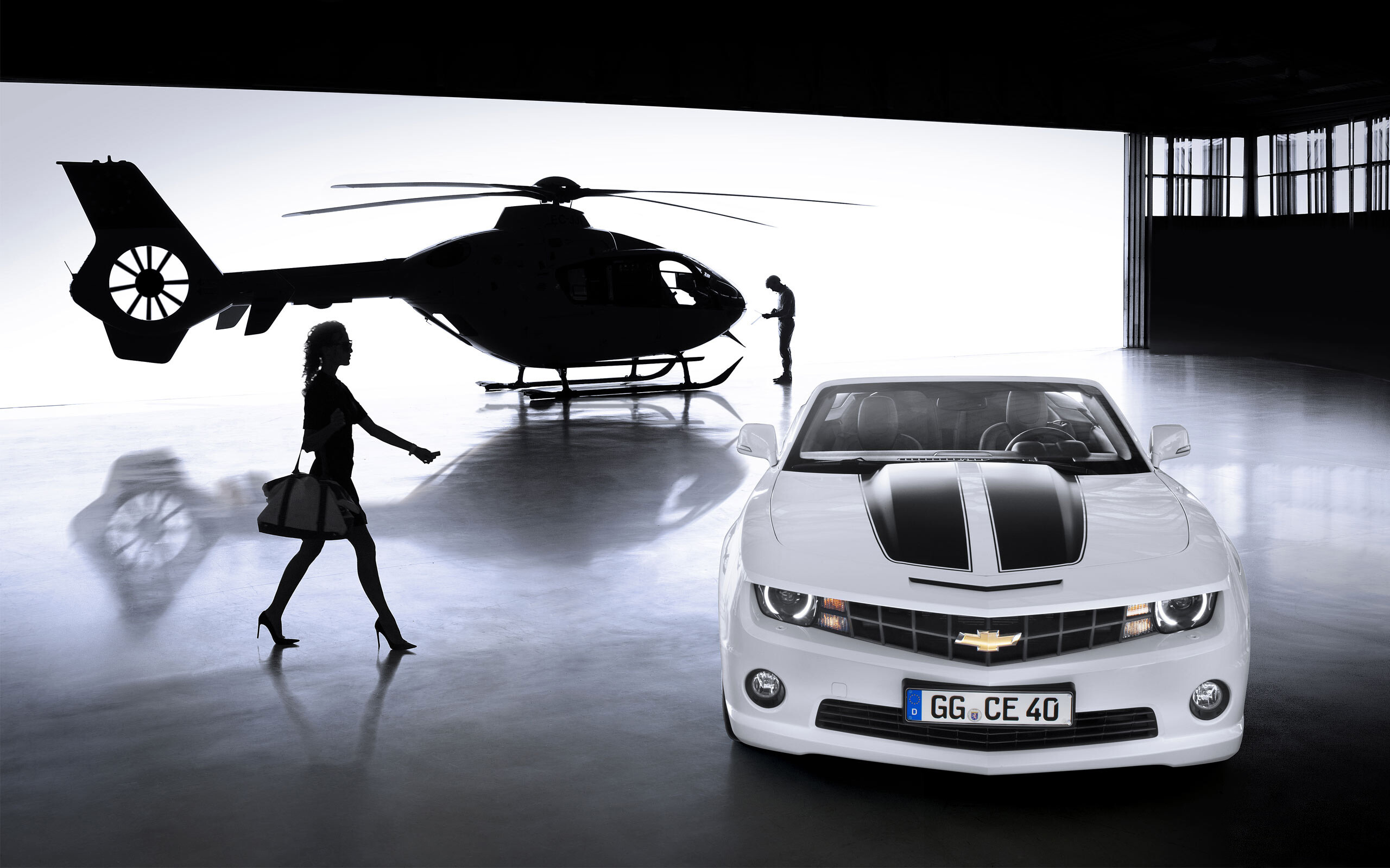 Girls and Muscle Cars: 2012 Chevrolet Camaro Convertible, Shadow figures, A helicopter hangar. 2560x1600 HD Background.
