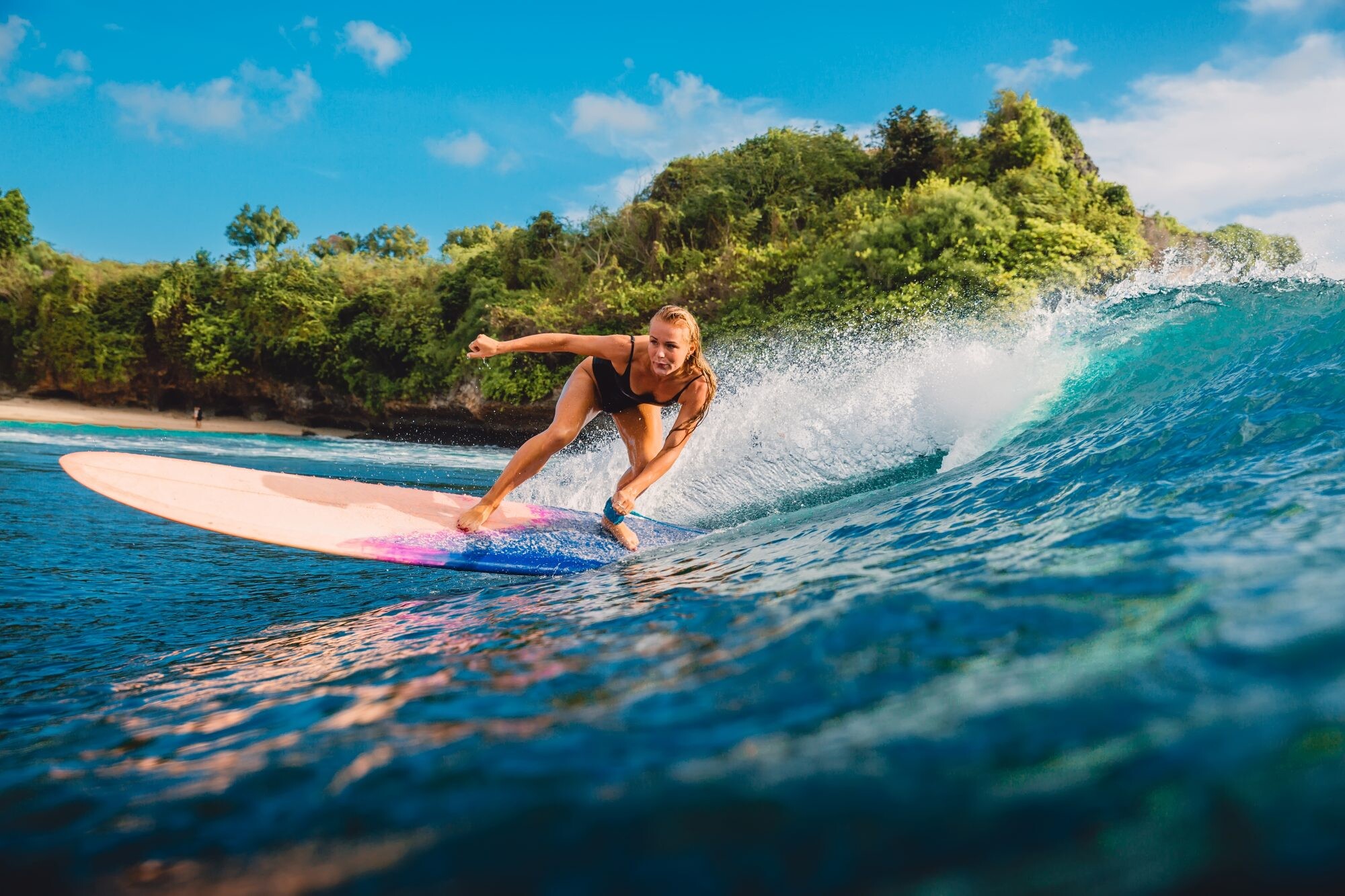 Girl Surfing: Women surf swimsuits, Riding a moving wave of water, Recreational water sports. 2000x1340 HD Wallpaper.