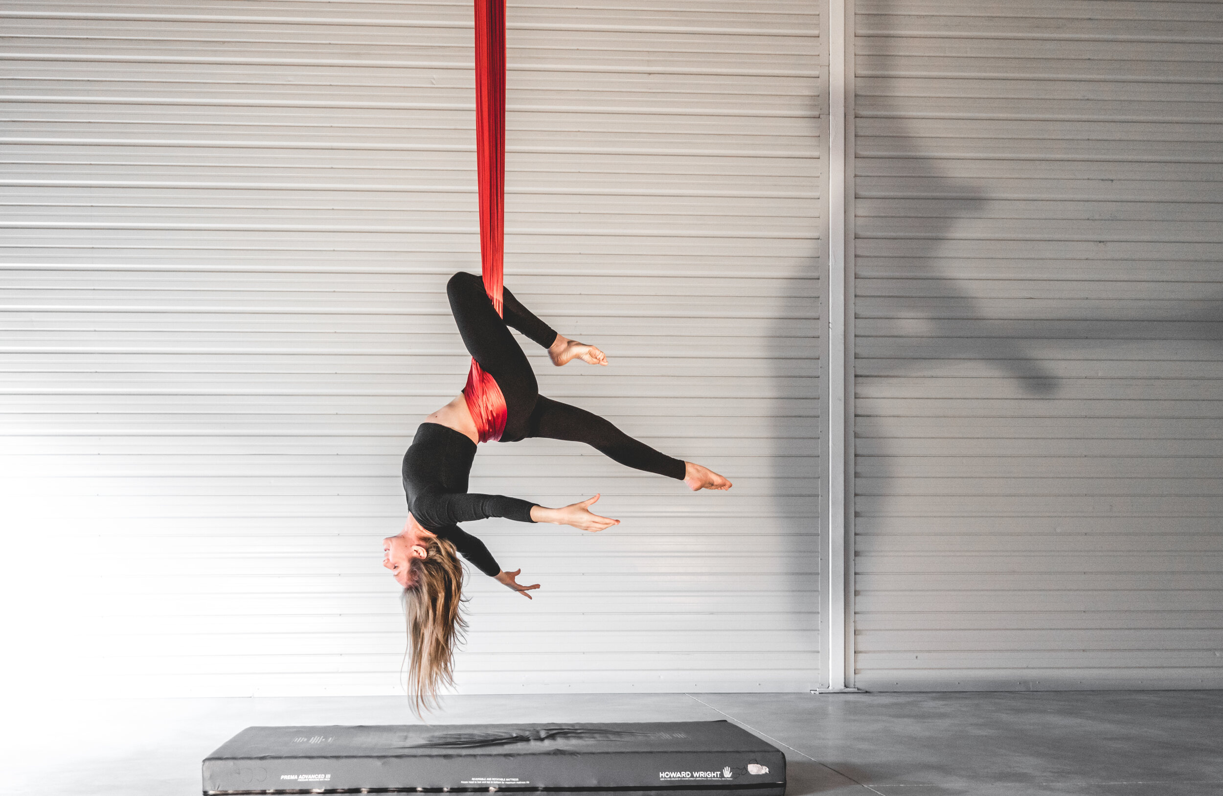 Aerial Silks: An acrobatics training session performed by a gymnast with a fabric. 2500x1630 HD Background.