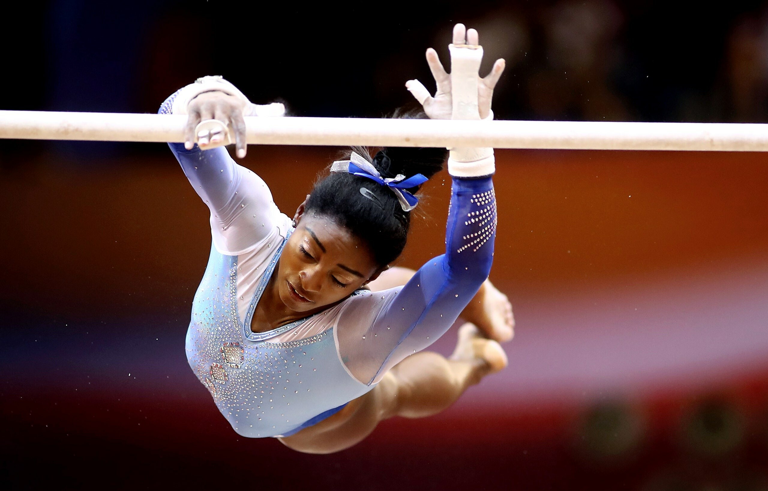 Simone Biles: The sixth woman to win an individual all-around title at both the World Championships and the Olympics. 2560x1640 HD Background.