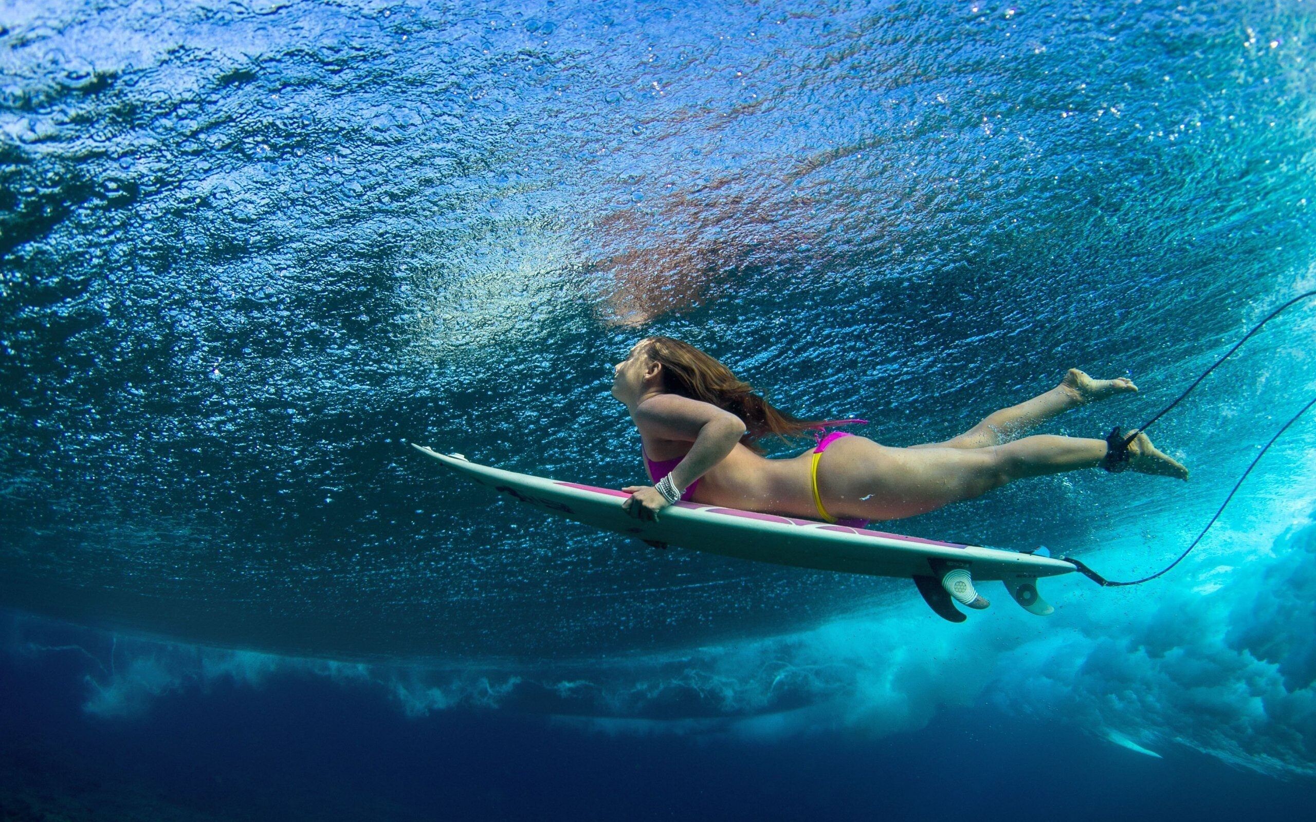 Girl Surfing: Tow-in cross-over water sports discipline, Underwater, Wave riding. 2560x1600 HD Background.