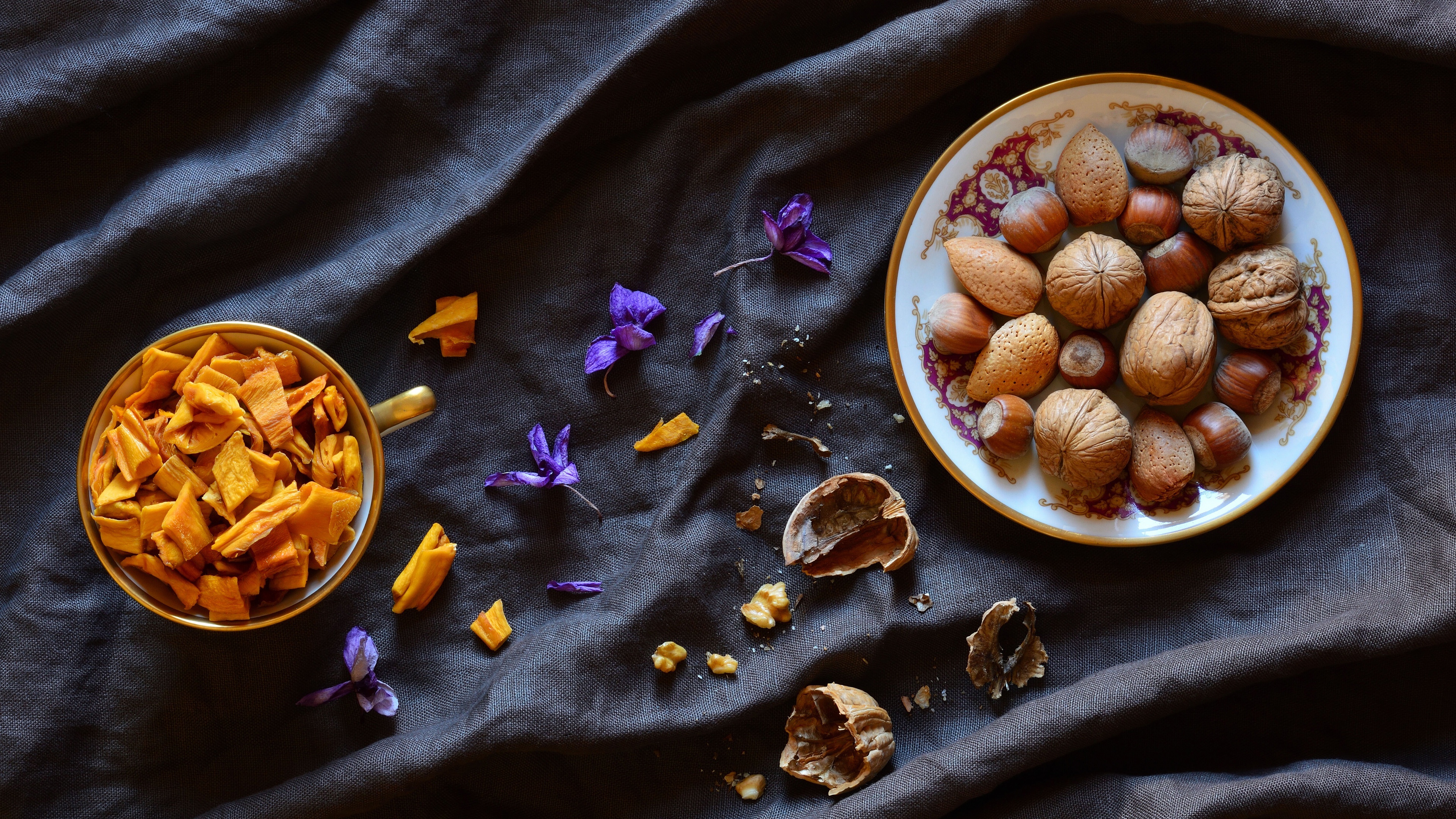 Dried Fruits: A walnut, The edible seed of any tree of the genus Juglans. 3840x2160 4K Background.