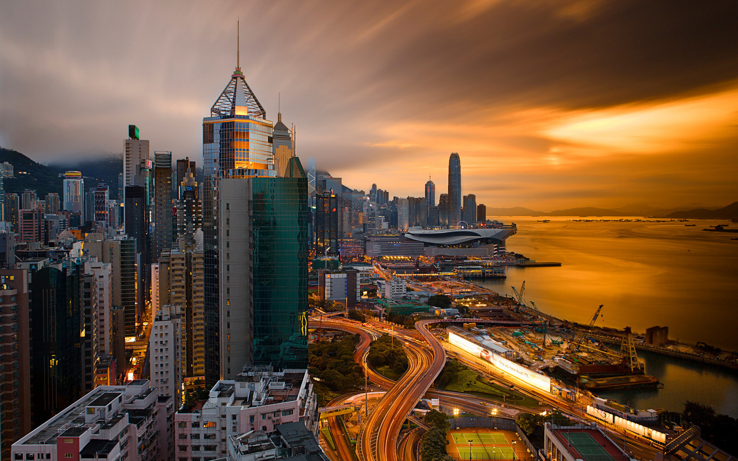 Hong Kong: Sino Plaza skyscraper at dusk, Modern architecture, Postmodernism style, Causeway Bay. 2560x1600 HD Wallpaper.