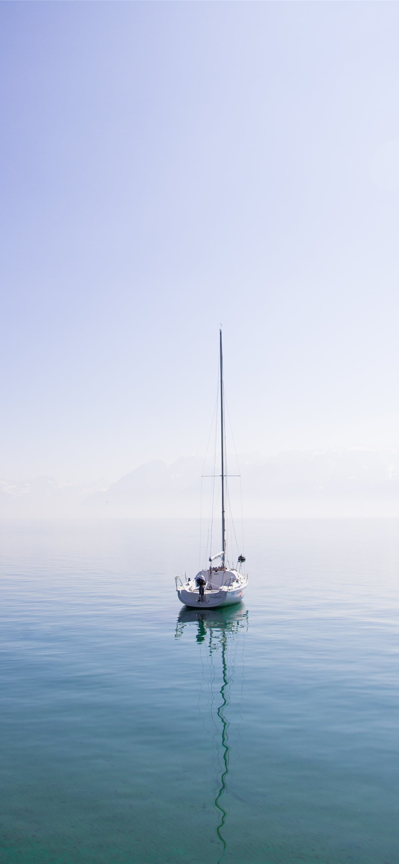 Boat: Moved by the wind hitting its sails at a particular angle. 1290x2780 HD Background.