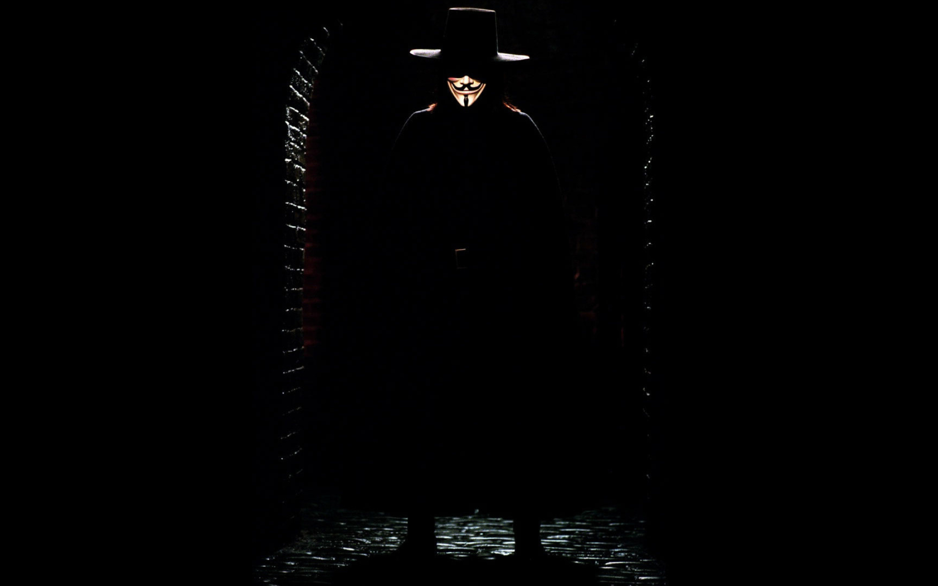 V for Vendetta: Freedom fighter who is easily recognizable by his Guy Fawkes mask, long hair and dark clothing. 1920x1200 HD Background.