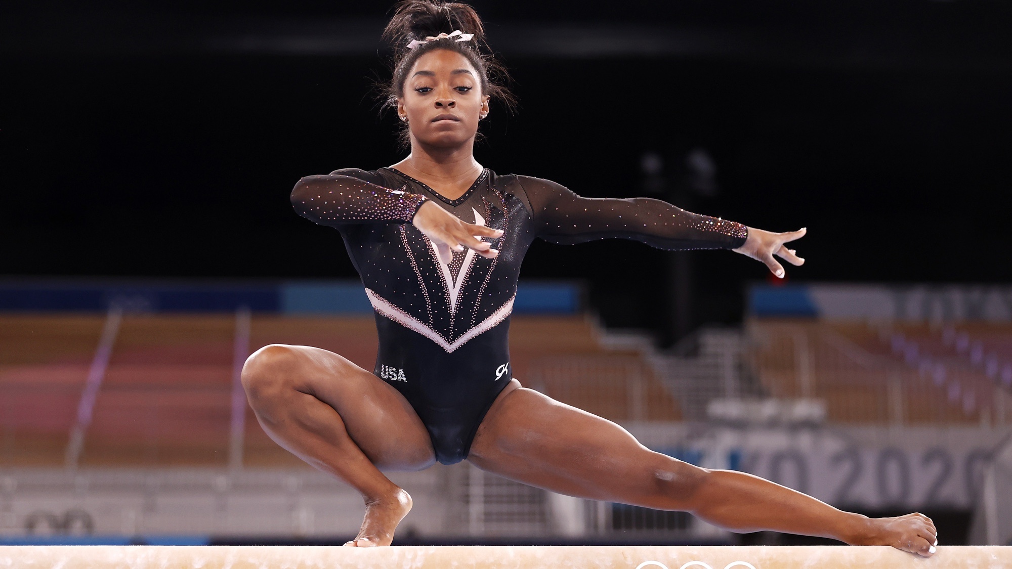 Balance Beam: Simone Biles, An American artistic gymnast, A seven-time United States national all-around champion. 2000x1130 HD Background.