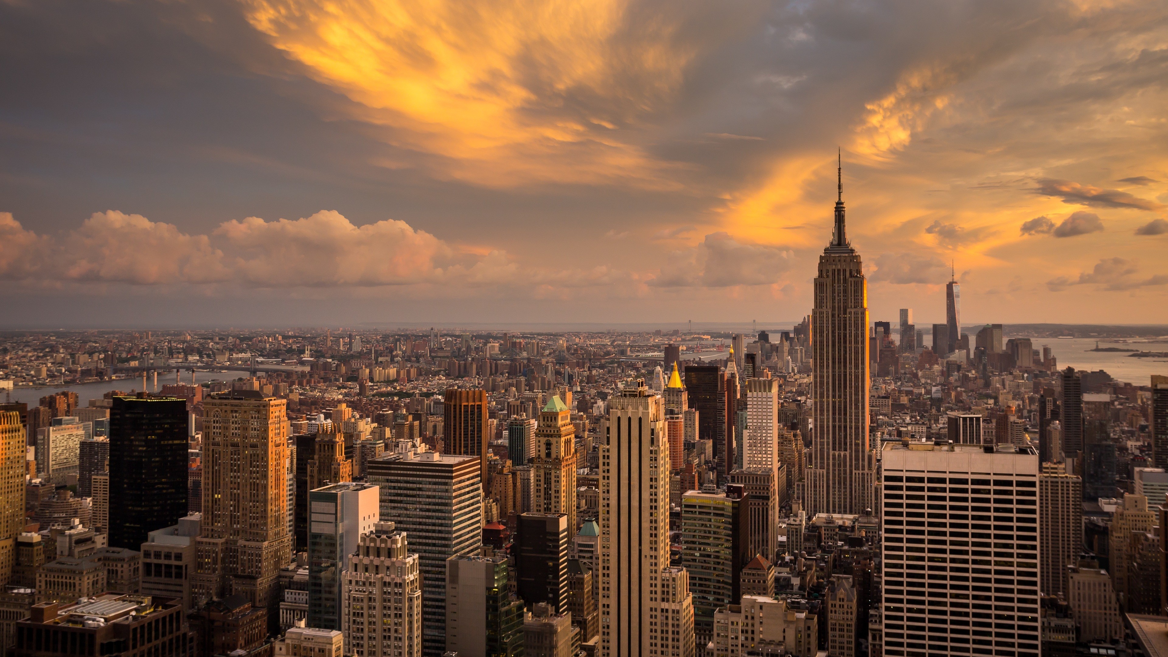 City: Sunset in Manhattan, New York, Empire State Building, The most densely populated megapolis in the United States. 3840x2160 4K Background.