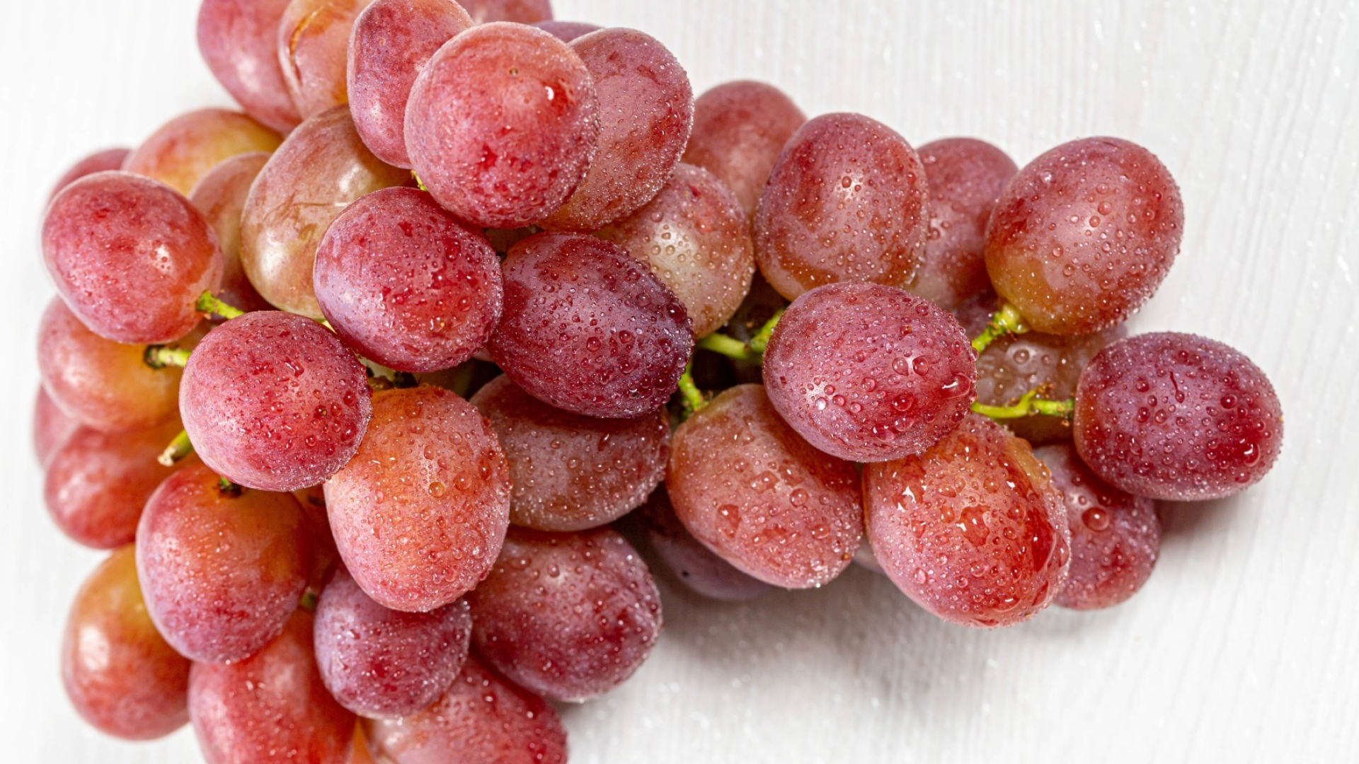Grapes: A berry containing hard seeds, Staple food. 1920x1080 Full HD Background.