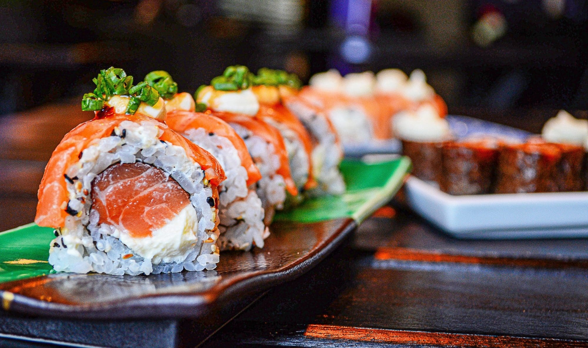 Sushi: Norwegian roll, Peaked with fresh salmon, White rice. 2000x1190 HD Wallpaper.