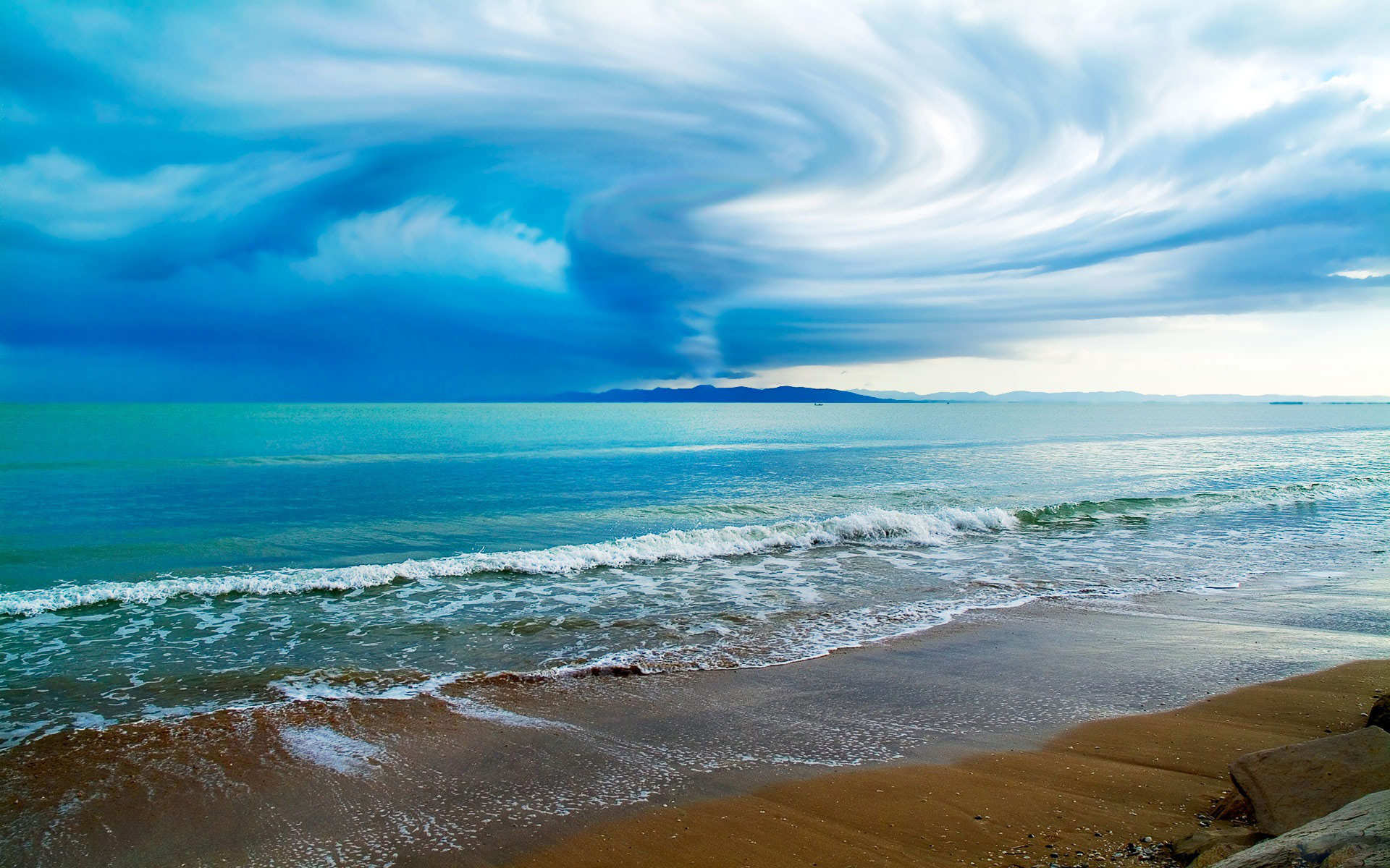 Seascape: Wonders of weather can be seen from the sandy coast of a tropical archipelago in the ocean. 1920x1200 HD Background.