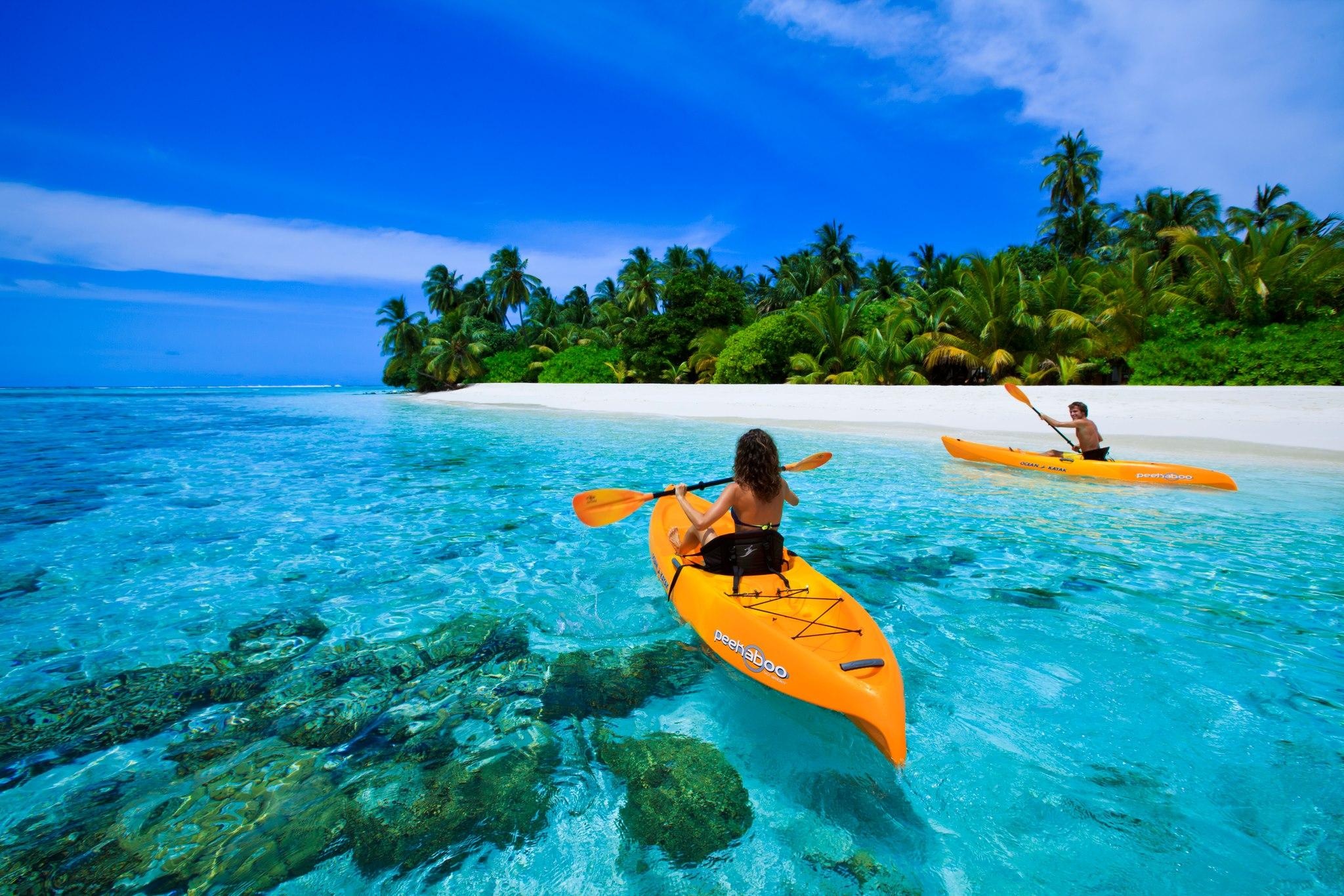 Canoeing: A recreational water sports activity in Blue Lagoon In Maldives. 2050x1370 HD Background.
