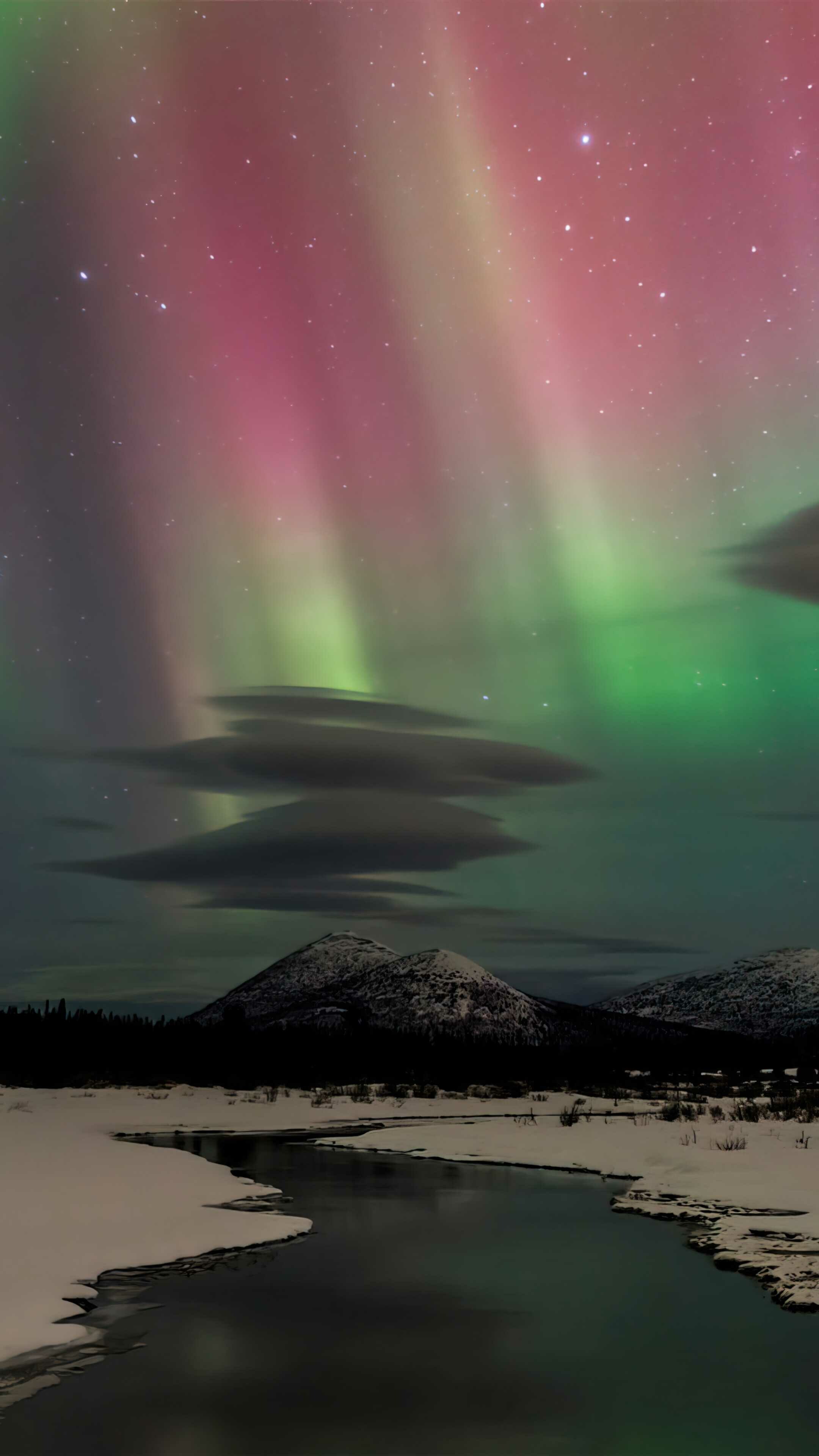 Aurora Borealis: The northern lights, Atmospheric phenomenon, Arctic Circle. 2160x3840 4K Background.
