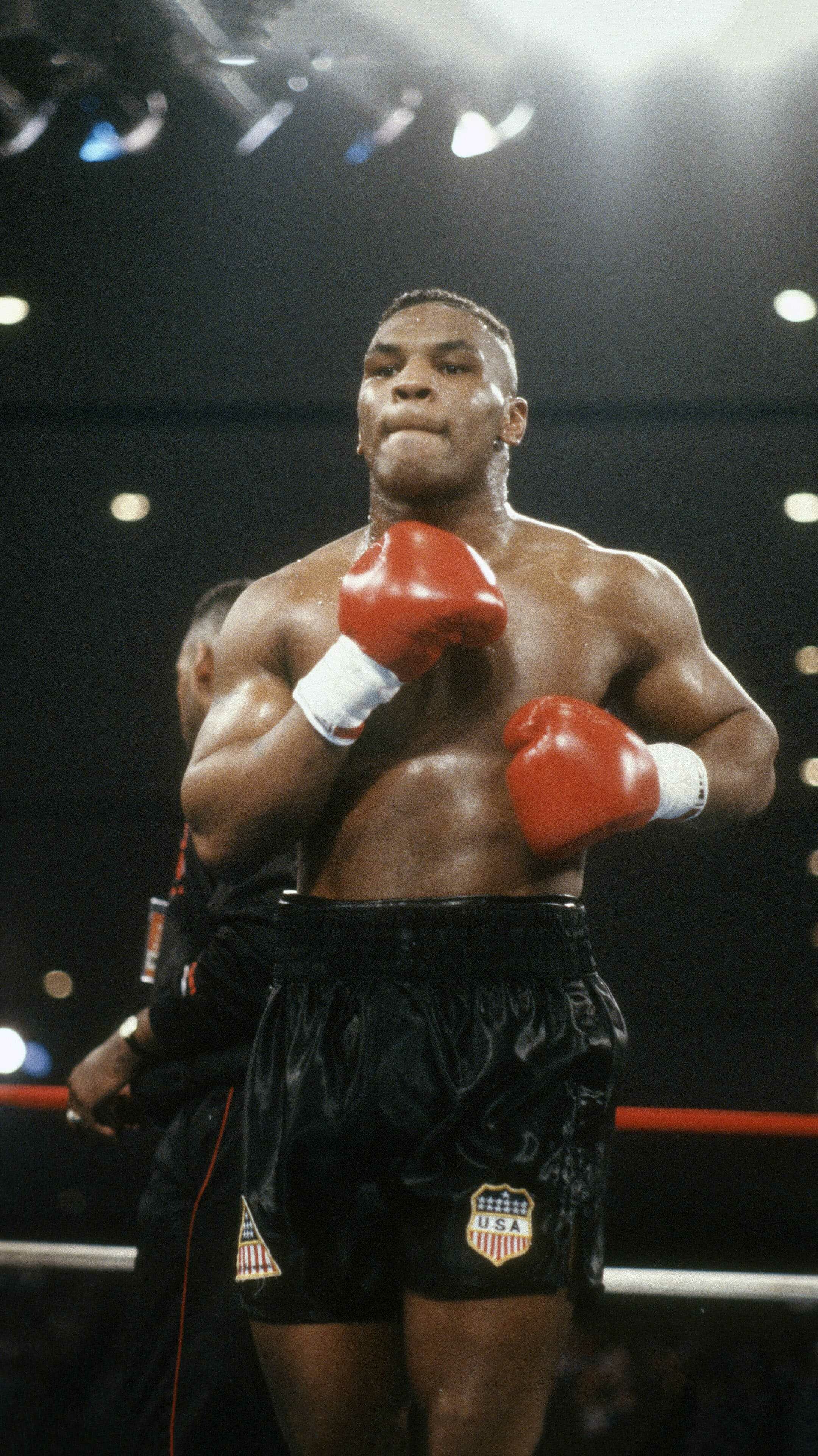 Mike Tyson: An American former professional boxer who competed from 1985 to 2005. 2160x3840 4K Background.