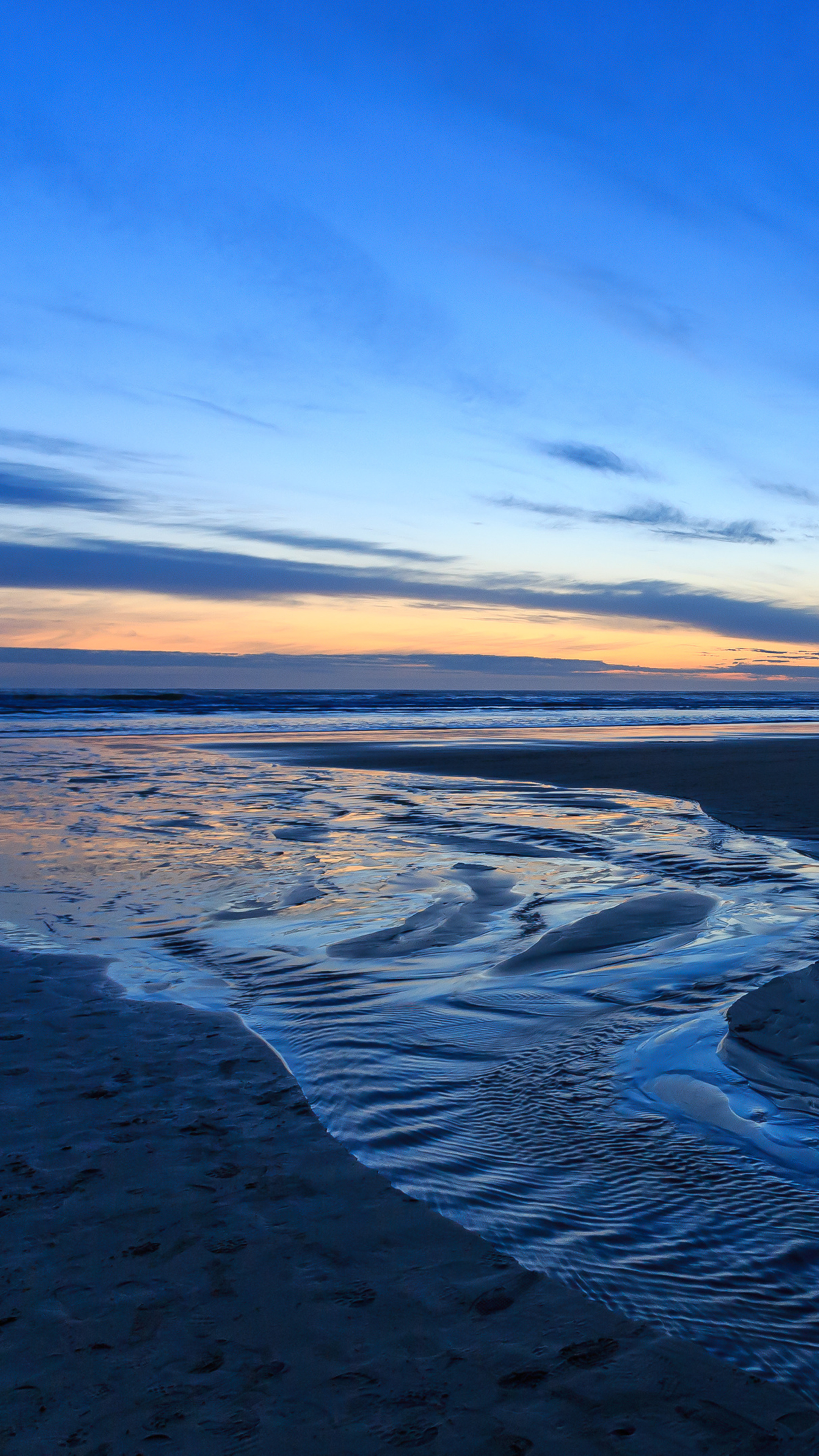 Seascape: Small coastal stream, Sandy sea beach, Incredible sunset time. 2160x3840 4K Background.
