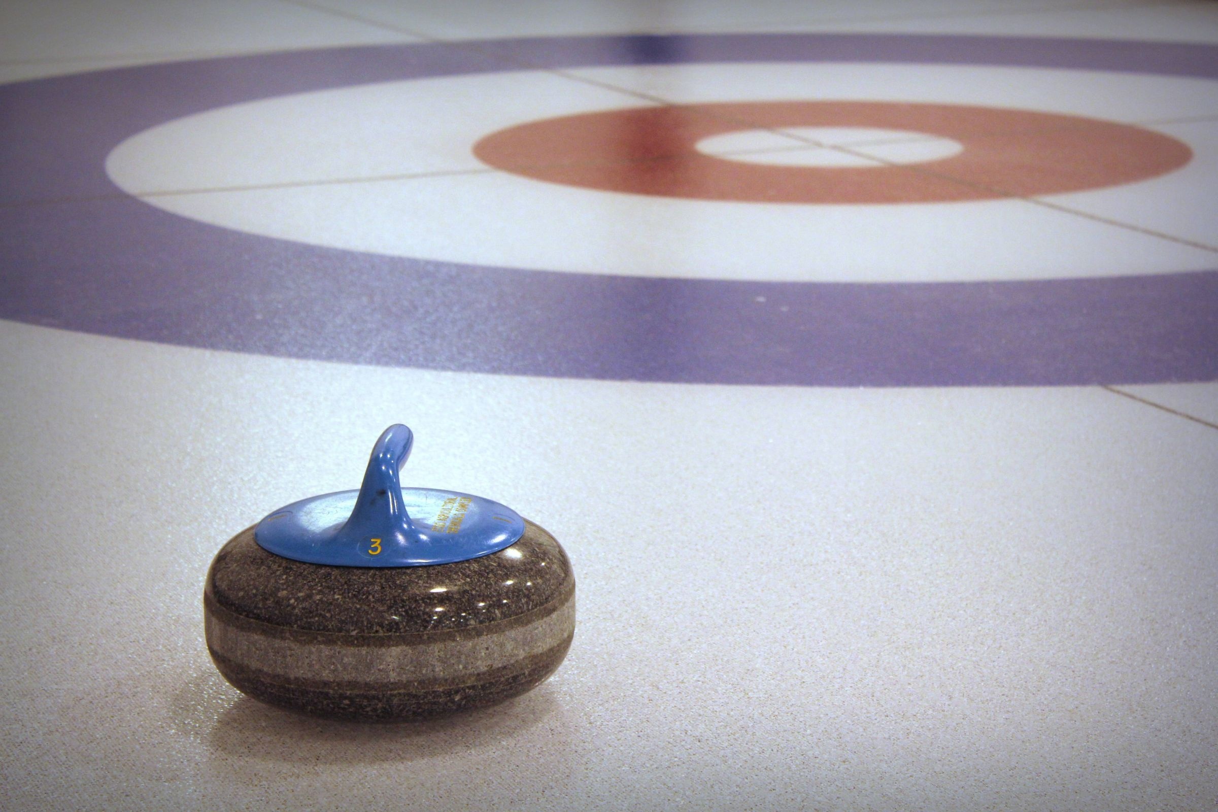 Curling: A granite stone on the ice, A traditional Ailsa Craig type of granite stone. 2400x1600 HD Background.