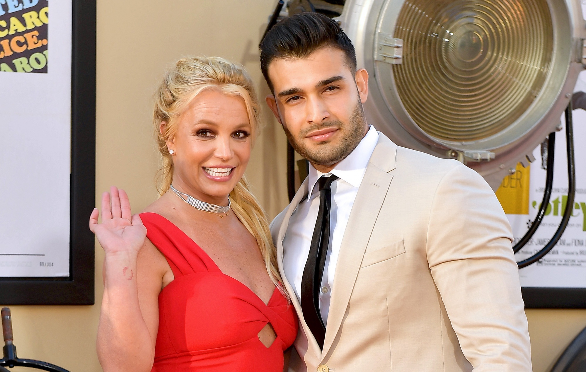 Sam Asghar and Britney Spears: A celebrity couple, Engaged after five years together, Music icon. 2000x1270 HD Background.