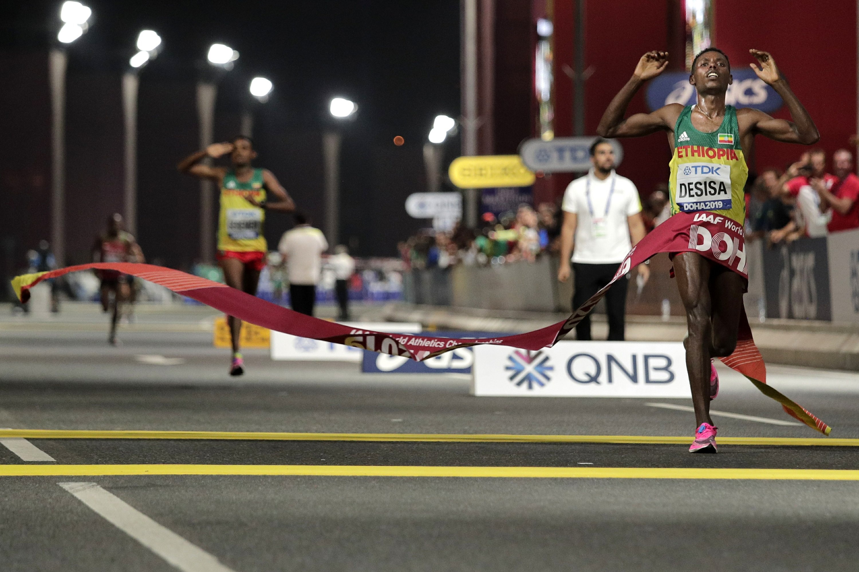 Lelisa Desisa, Marathon victory in Doha, Ethiopian champion, AP News coverage, 3000x2000 HD Desktop