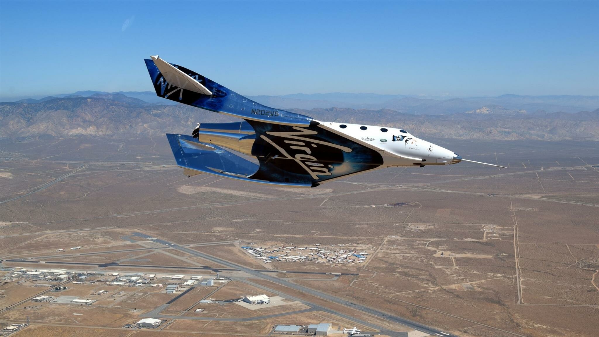 Virgin Galactic: A vertically-integrated aerospace and space travel company, Richard Branson. 2050x1160 HD Background.