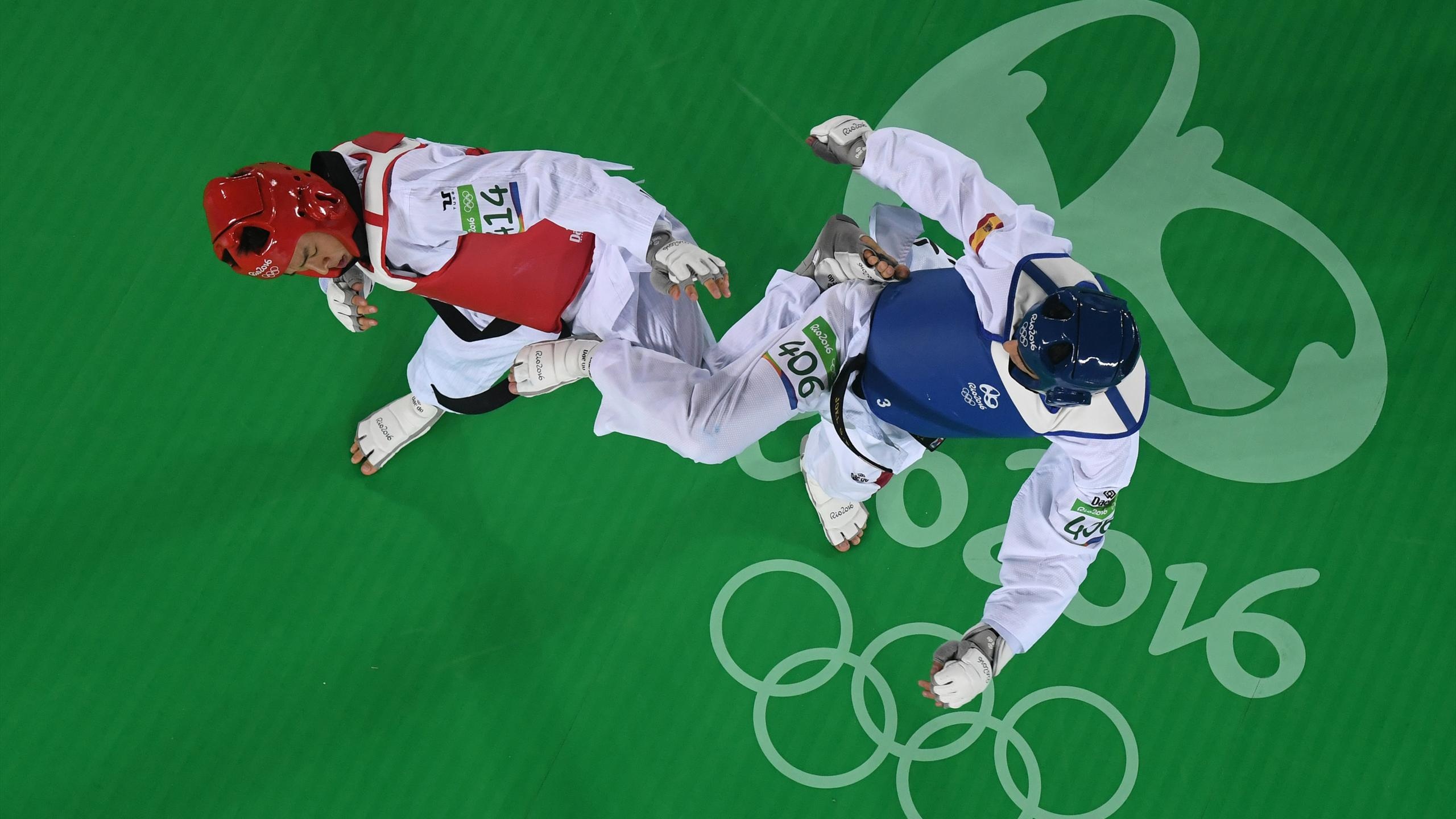 Taekwondo: Joel Gonzalez vs. Ahmad Abughaush, 2016 Rio Summer Olympics. 2560x1440 HD Wallpaper.