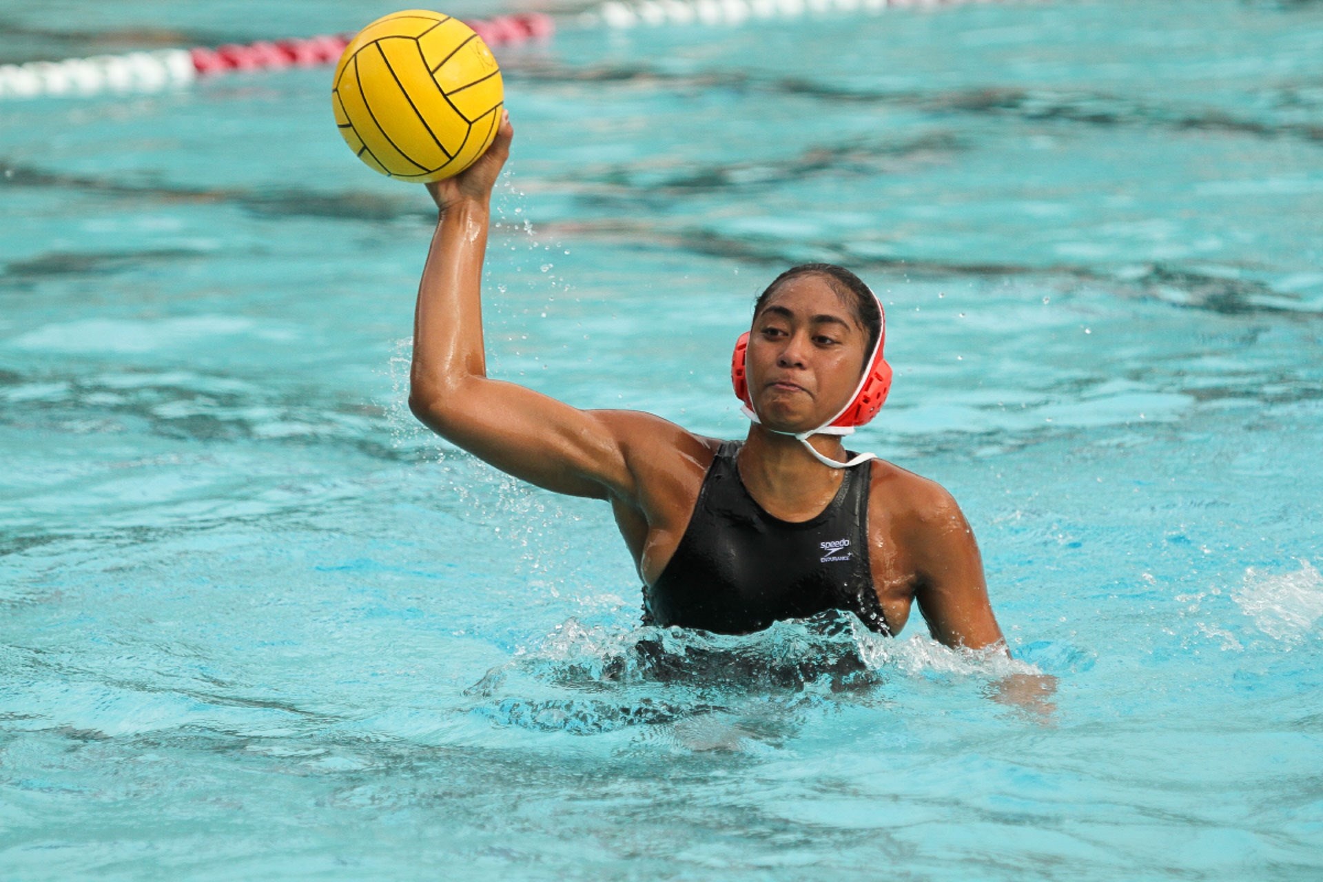 Water Polo: A female poloist during a match in a competition swimming pool. 1920x1280 HD Background.