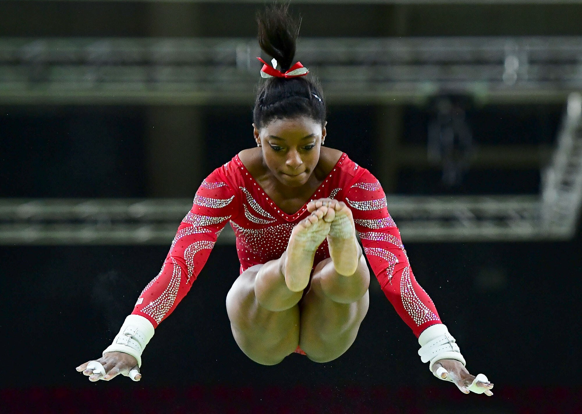 Simone Biles: She won her second consecutive world all-around title at the 2014 World Artistic Gymnastics Championships. 2000x1430 HD Background.