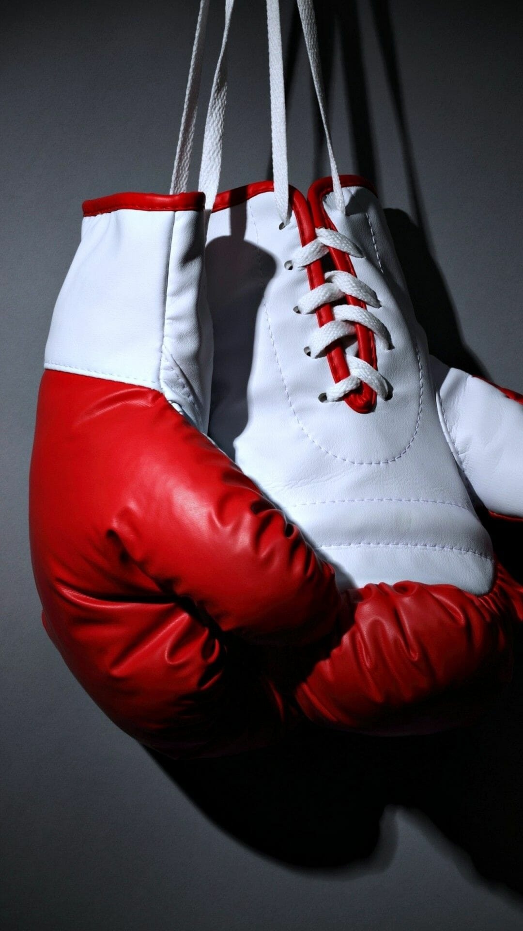 Hanging boxing gloves, Sports symbol, Motivational image, Striking wallpaper, 1080x1920 Full HD Phone