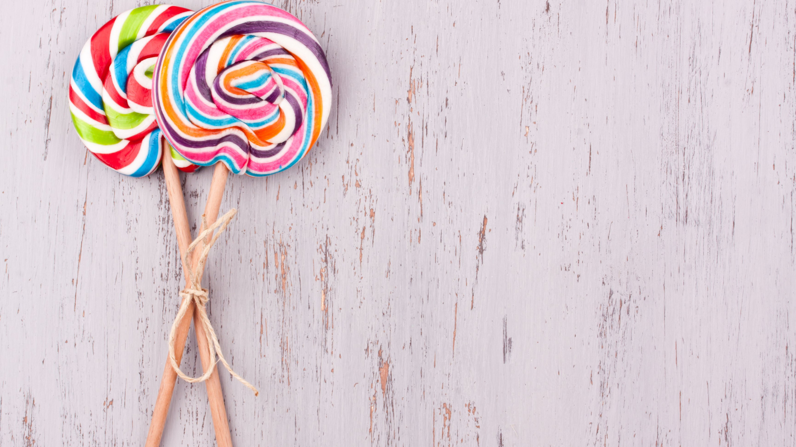 Lollipop background wallpaper, Eye-catching design, Sweet temptation, Candy lover's delight, 2560x1440 HD Desktop