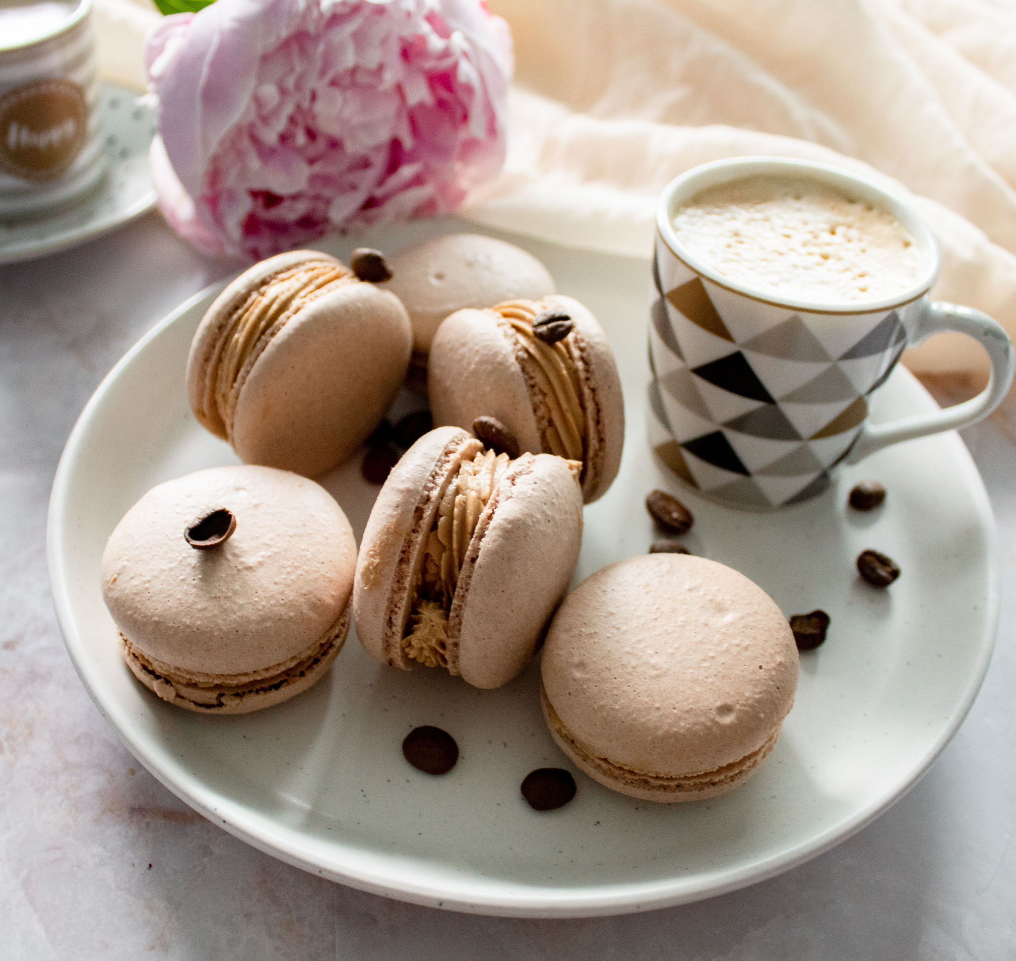Macaron: Coffee flavored shell, Chocolate ganache, Sprinkles, Scribbles. 2050x1940 HD Background.