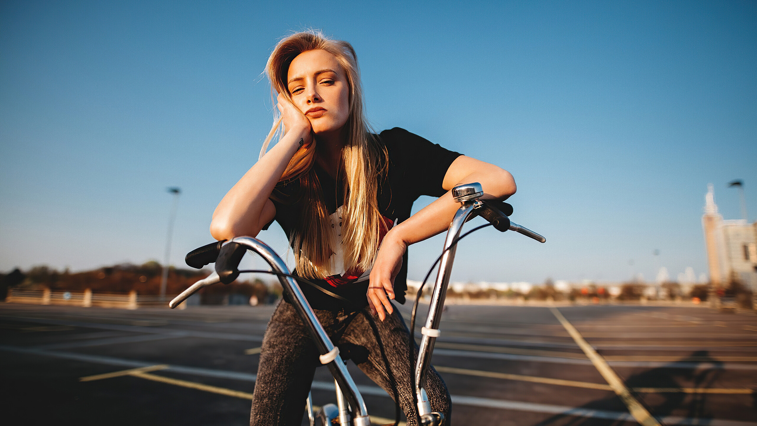 Girl and Bike: Bicycle handlebar, Brake levers, Urban cycling, Woman sitting on bike. 2560x1440 HD Background.