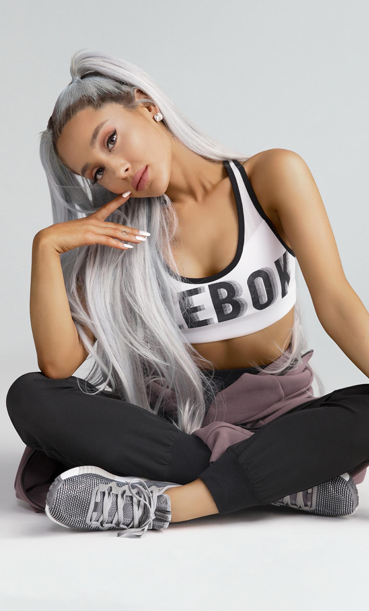 Reebok: Collaboration with Ariana Grande, The world's biggest pop star, The brand ambassador with credibility and impact. 1280x2120 HD Background.
