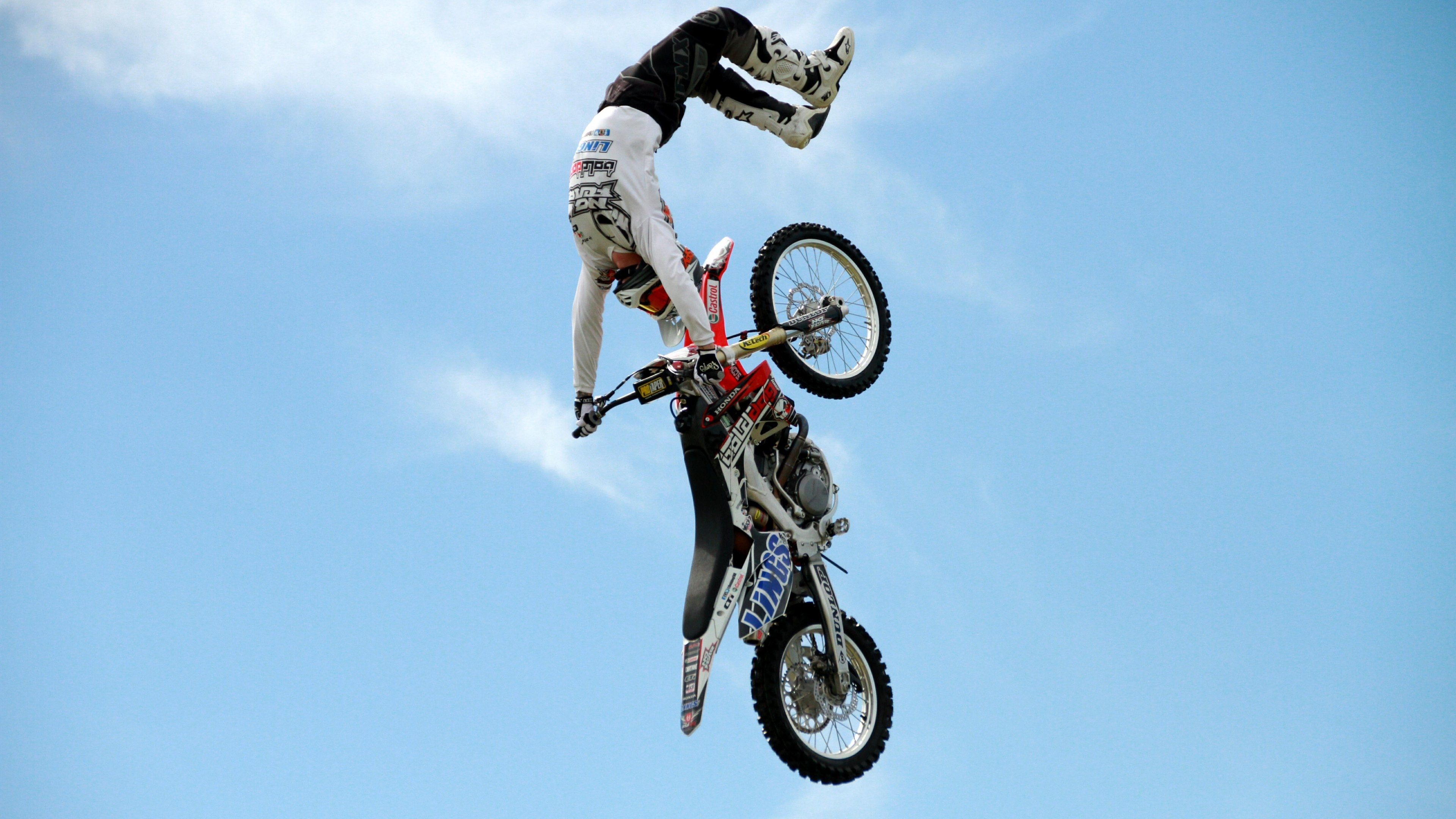 Stunt: Motorcross, Stuntman in the air, Acrobatics on a dirt bike. 3840x2160 4K Wallpaper.