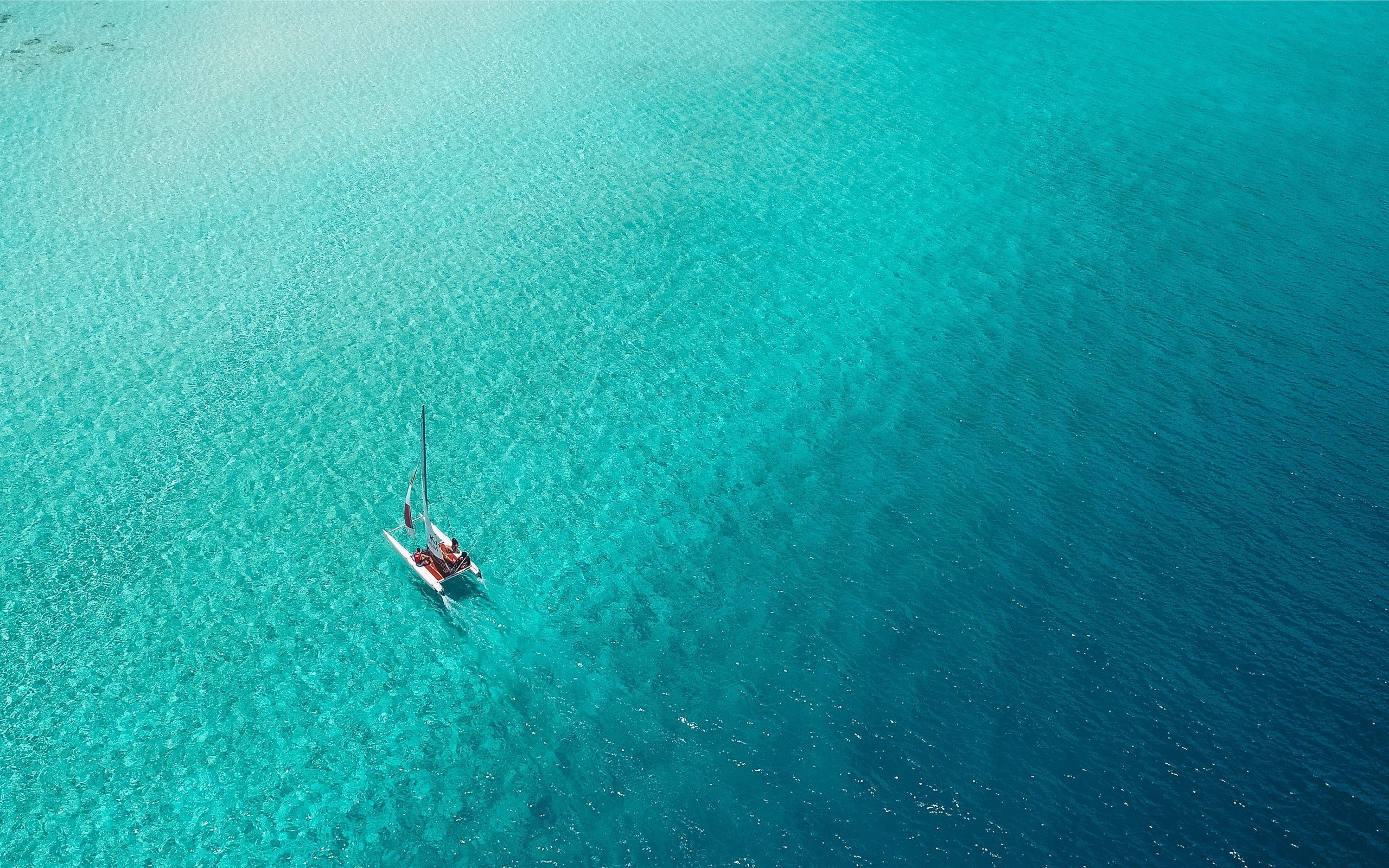 Catamaran: A sail or engine-powered boat with a double hull, Blue-water cruising. 2560x1600 HD Wallpaper.